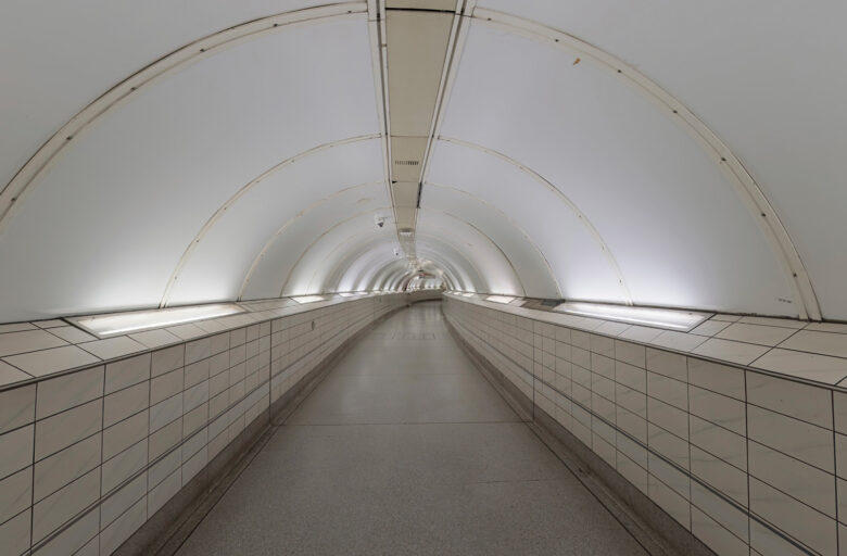 TFL tube station with view along a pedestrian tunnel underground.