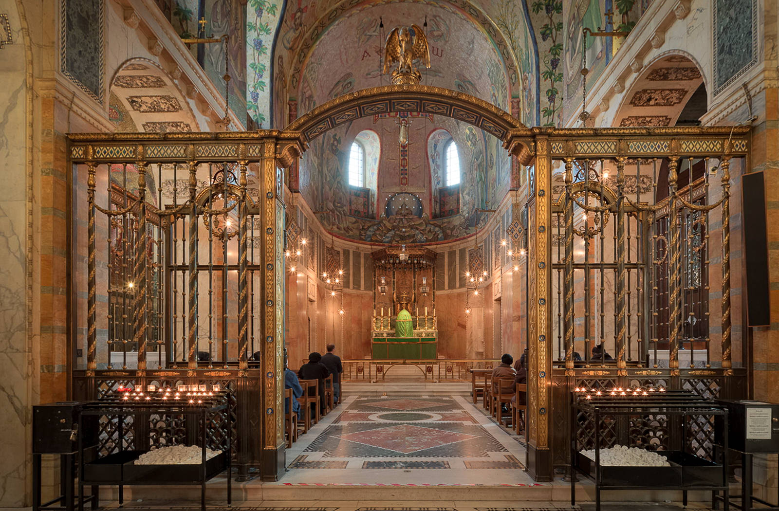 View of one of the altars from a Westminster Cathedral virtual tour. Worshippers are seen sitting quietly to pray in this smaller side chapel.